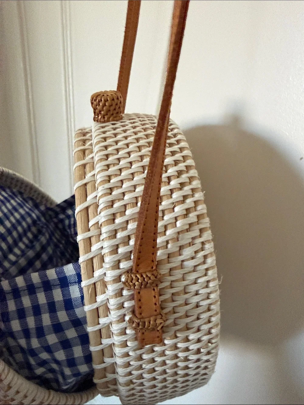 Round Straw Crossbody Bag with Yellow Floral Embroidery. 8x8 in., 24in strap